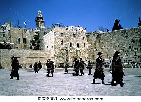 Stock Photo - Israel, Jerusalem, praying jews in front of the Western Wall. Fotosearch