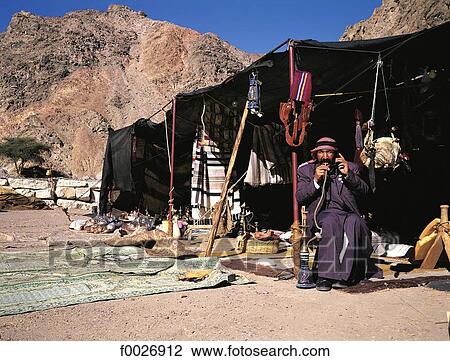 Israel, near Eilat, Negev desert, man in his Bedouin tent View Large Photo Image Stock Image - Israel, near Eilat, Negev desert, man in his Bedouin tent. Fotosearch