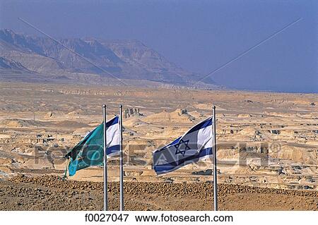 Stock Photo - Israel, near the Dead Sea, Judean desert, Masada, Israeli flags. Fotosearch