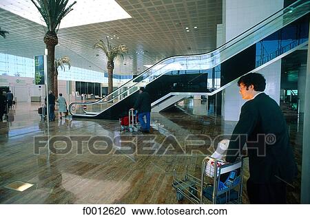 Stock Image - Spain, Barcelona, airport, passenger. Fotosearch