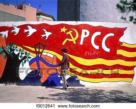 Stock Image - Spain, Barcelona, pedestrian behind a mural. Fotosearch