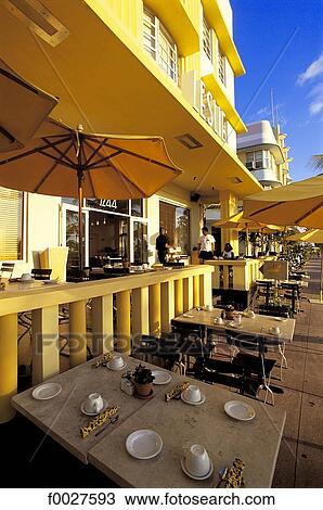 Stock Image - United States, Florida, Miami Beach, Ocean Drive, restaurant terrace. Fotosearch