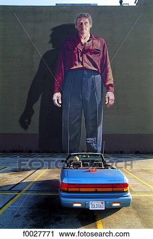 Stock Image - United States, California, Los Angeles, Downtown, convertible by a Ken Mitchell mural. Fotosearch