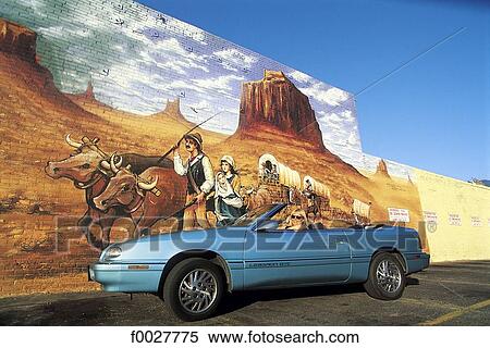 Stock Photography - United States, California, Los Angeles, Downtown, convertible by a mural. Fotosearch