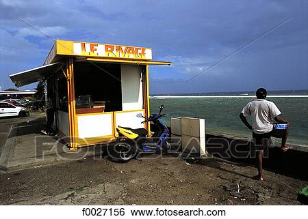 Stock Photograph - Reunion, Saint-Pierre, cafe stall by the beach. Fotosearch
