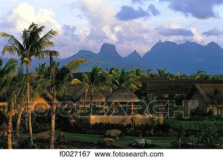 Stock Photo - Mauritius, bungalows at dusk. Fotosearch
