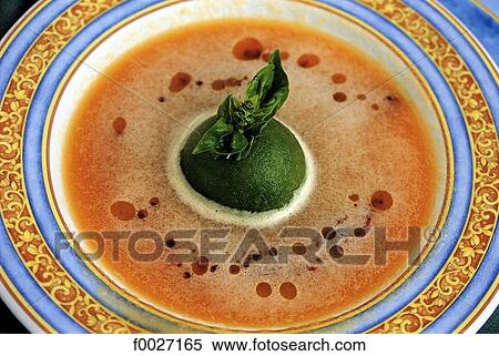 Stock Photography - Mauritius, local gastronomy, dish of goose liver with wild spinach. Fotosearch