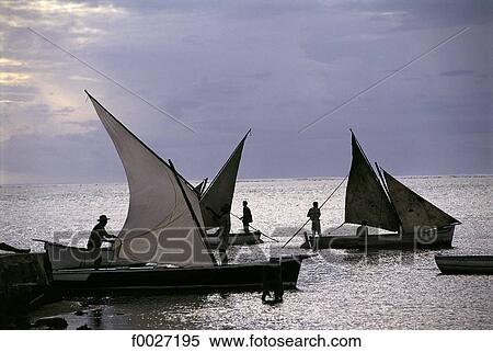 Stock Photography - Mauritius, traditional fishing boats with sails. Fotosearch