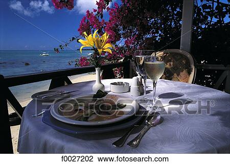 Stock Image - Mauritius, Trou-aux-Biches, restaurant terrace. Fotosearch