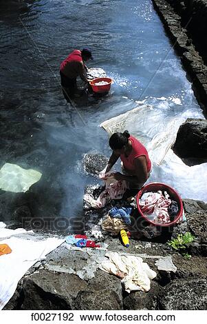 Mauritius, women washing linen View Large Photo Image Stock Image - Mauritius, women washing linen. Fotosearch