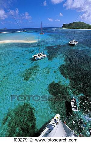 Stock Image - Mauritius, île aux cerfs, leisure boats. Fotosearch