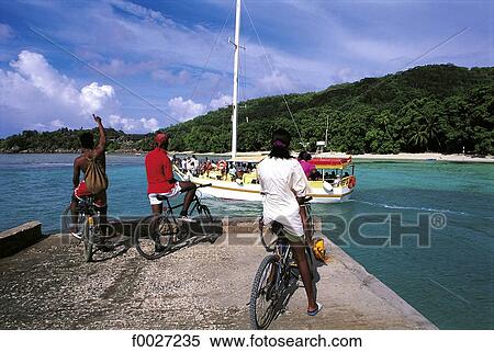 Seychelles, La Digue, bikes and taxi-boat View Large Photo Image Stock Photography - Seychelles, La Digue, bikes and taxi-boat. Fotosearch