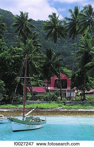 Stock Photo - Seychelles, La Digue, boat and colonial house. Fotosearch