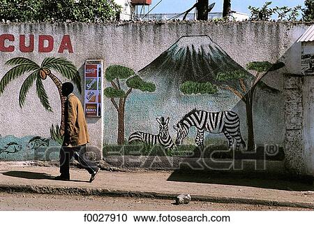 Stock Image - Tanzania, Arusha, painted ad on a wall. Fotosearch