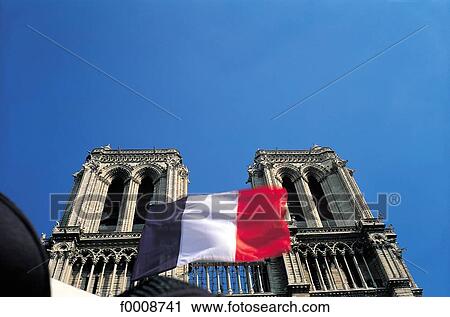 Stock Image - France, Paris, flag on Notre Dame. Fotosearch