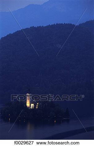 Slovenia, Bled, lake and church on an island by night View Large Photo Image Stock Photo - Slovenia, Bled, lake and church on an island by night. Fotosearch