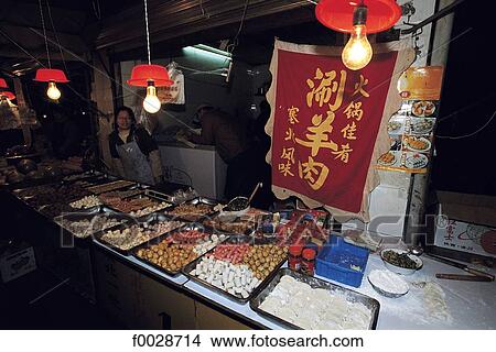 Picture - China, Shanghai, central night market, food stall. Fotosearch