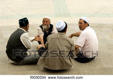 Picture - China, Xinjiang, kashgar, group of Uyghur men. Fotosearch