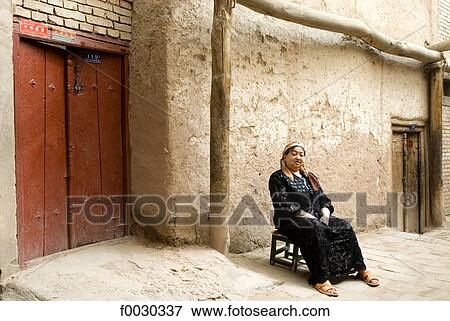 China, Xinjiang, kashgar, old city, seated woman View Large Photo Image Stock Photo - China, Xinjiang, kashgar, old city, seated woman. Fotosearch