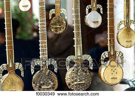 China, Xinjiang, kashgar, old city, traditional Uyghur musical instruments View Large Photo Image Stock Photo - China, Xinjiang, kashgar, old city, traditional Uyghur musical instruments. Fotosearch