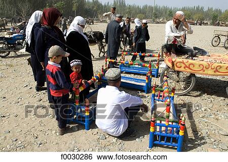 China, Xinjiang, Keriya, market, Uyghur cradles on sale View Large Photo Image Stock Photograph - China, Xinjiang, Keriya, market, Uyghur cradles on sale. Fotosearch