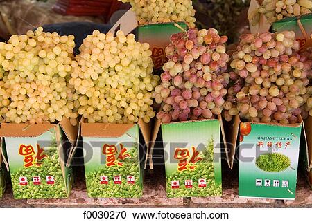 Stock Image - China, Xinjiang, near Turpan, grapes. Fotosearch