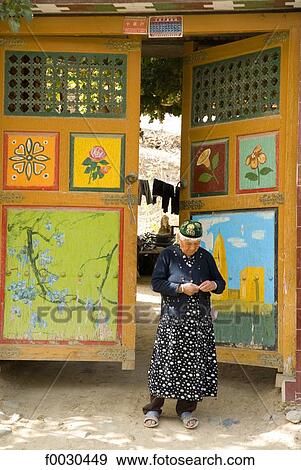 China, Xinjiang, Turpan, traditional Uyghur dwelling, old woman View Large Photo Image Stock Photo - China, Xinjiang, Turpan, traditional Uyghur dwelling, old woman. Fotosearch