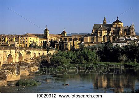 Stock Image - Spain, Andalusia, Cordoba, Guadalquivir River Roman bridge and Great mosque. Fotosearch