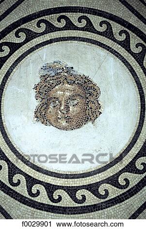 Stock Image - Spain, Andalusia, Cordoba, the alcazar, Roman mosaic of head of medusa. Fotosearch
