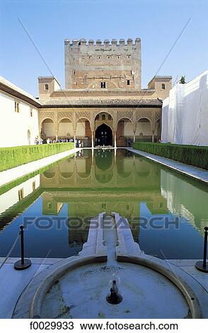 Stock Image - Spain, Andalusia, Granada, the Alhambra, patio de los Arrayanes (court of the myrtles) and Tower of Comares. Fotosearch