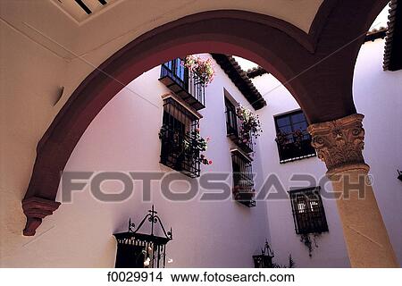 Picture - Spain, Andalusia, Ronda, a typical courtyard. Fotosearch