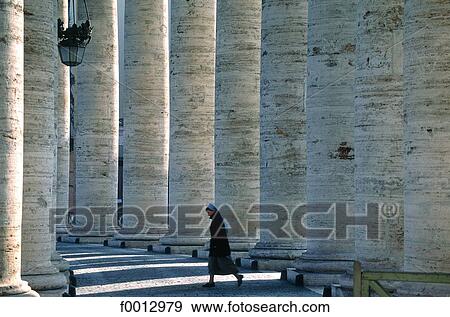 Stock Photo - Italie, Rome, Vatican, place Saint-Pierre, religieuse sous la colonnade du Bernin. Fotosearch