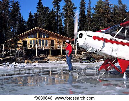 Canada, Ontario, Halley's camp, avion et chalet de bois View Large Photo Image Stock Photograph - Canada, Ontario, Halley's camp, avion et chalet de bois. Fotosearch