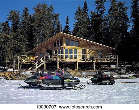 Stock Photo - Canada, Ontario, Halley's camp, motoski et chalet de bois. Fotosearch
