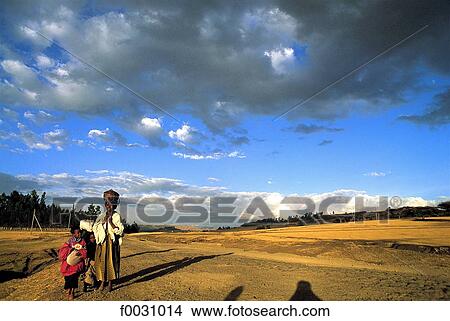 Picture - Ethiopia, near Debark, young girl and landscape. Fotosearch