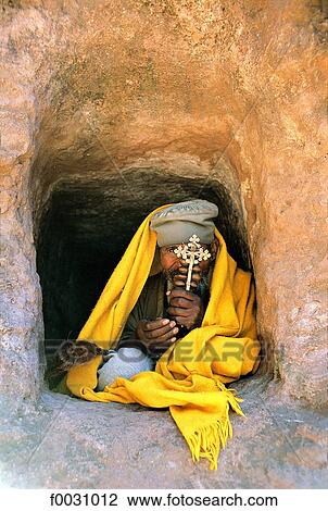 Ethiopia, Wollo region, Lalibela, man holding an orthodox cross View Large Photo Image Stock Image - Ethiopia, Wollo region, Lalibela, man holding an orthodox cross. Fotosearch
