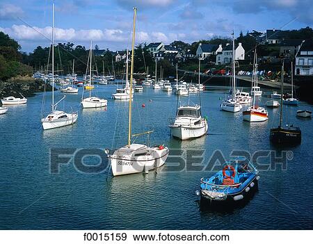 Stock Photo - France, Brittany, Doëlan, boats in the port. Fotosearch