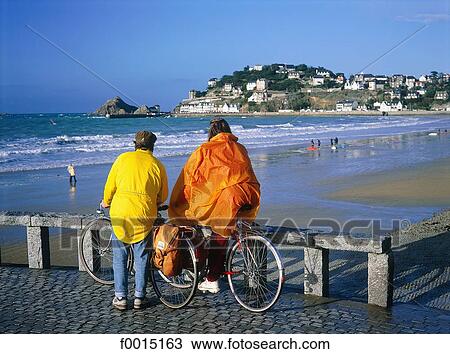 France, Brittany, Pléneuf, couple wathching the beach View Large Photo Image Stock Image - France, Brittany, Pléneuf, couple wathching the beach. Fotosearch
