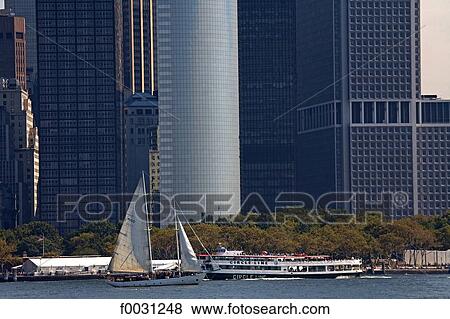 United States, New York, cruise around Manhattan island, sailing boat and boat by skyscraper View Large Photo Image Stock Photo - United States, New York, cruise around Manhattan island, sailing boat and boat by skyscraper. Fotosearch