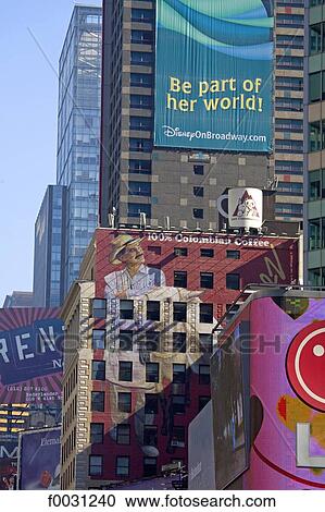 Stock Image - United States, New York, Manhattan, near Times square, buildings facades covered by advertising posters. Fotosearch