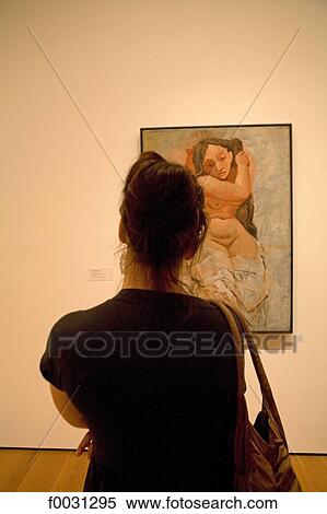 Stock Photography - United States, New York, Manhattan, Metropolitan museum, woman watching a Pablo Picasso picture. Fotosearch