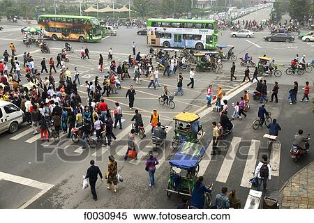 China, Sichuan, Chengdu, downtown, pedestrians at a crossroad View Large Photo Image Stock Photography - China, Sichuan, Chengdu, downtown, pedestrians at a crossroad. Fotosearch