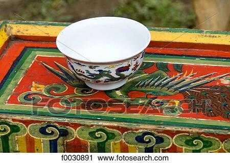 Stock Image - China, Sichuan, decorated bowl and chest. Fotosearch