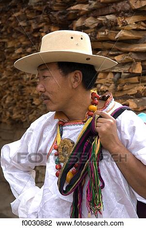 China, Sichuan, near Danba, Tibetan village festival, portrait of a Tibetan man View Large Photo Image Stock Image - China, Sichuan, near Danba, Tibetan village festival, portrait of a Tibetan man. Fotosearch