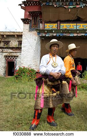 Stock Photo - China, Sichuan, near Danba, Tibetan village festival, men in traditional costume. Fotosearch