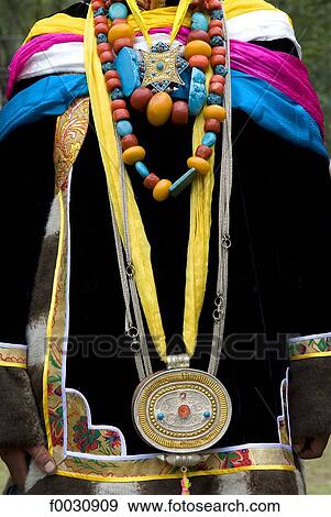 Stock Photo - China, Sichuan, near Danba, Tibetan traditional jewels wearing during a village festival. Fotosearch