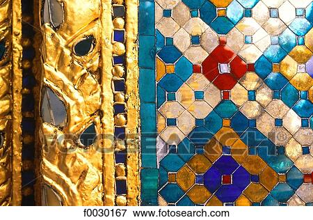 Thailand, Bangkok, Grand Palace and emerald Buddha temple "Wat Phra Keo", close-up on a carved frieze with colored glass View Large Photo Image Stock Photo - Thailand, Bangkok, Grand Palace and emerald Buddha temple "Wat Phra Keo", close-up on a carved frieze with colored glass. Fotosearch