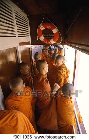 Stock Photograph - Thailand, Bangkok, monks on the Chao Phraya river. Fotosearch