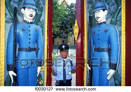 Thailand, Bangkok, Wat Rajobopit Buddist temple, warden opening the carved gates View Large Photo Image Stock Photo - Thailand, Bangkok, Wat Rajobopit Buddist temple, warden opening the carved gates. Fotosearch