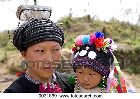 Stock Photo - Vietnam, road to Sappa, Hmong woman and her child.. Fotosearch